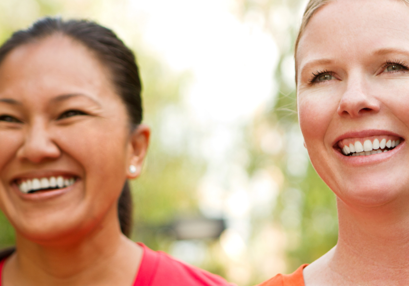 close up shot of two women, and asian woman on the left and a white woman on the right